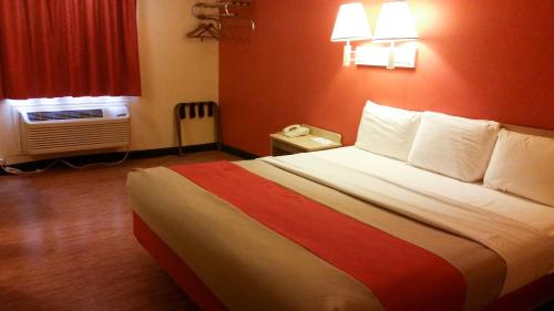 a hotel room with a large bed and a window at Motel 6 Elk City, Ok in Elk City