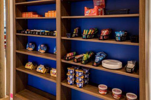 a pantry filled with lots of different types of food at Holiday Inn Express - North Augusta South Carolina by IHG in North Augusta