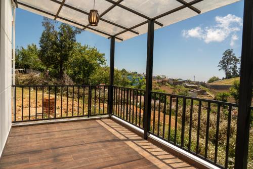 a view from the balcony of a house at VGR-HOMESTAY in Kodaikānāl