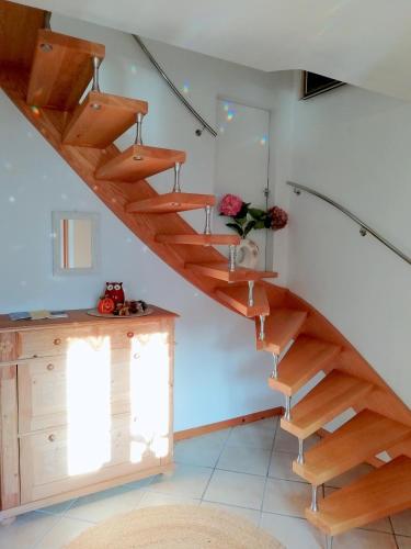 a wooden staircase in a room with a window at Apartment Müllerstiege in Hallstatt