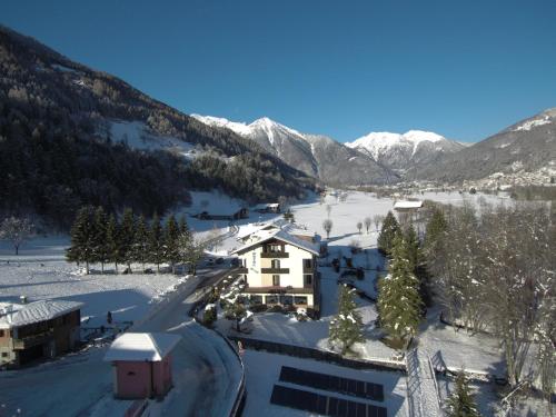 a ski resort in the mountains with snow on the ground at Hotel Rio in Caderzone