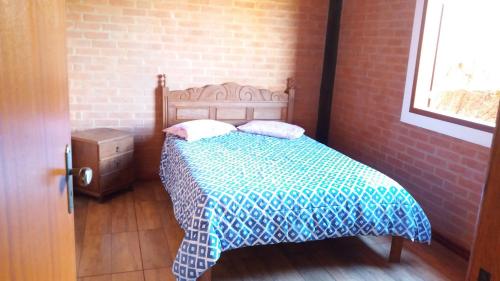 מיטה או מיטות בחדר ב-Casa Recanto da Serra