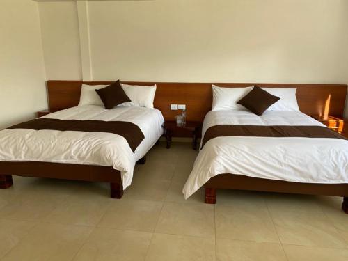 Una cama o camas en una habitación de Hosteria Quinta Paraiso