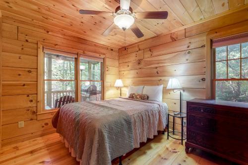 a bedroom with a bed and a ceiling fan at Indian Rock Lake in Blue Ridge