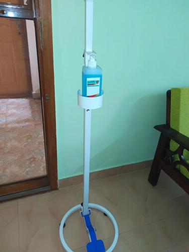 a water mop sitting on the floor in a room at Hotel NKC Airport in Chennai