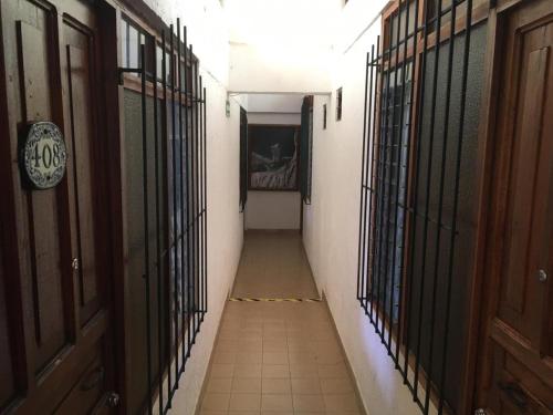 an empty hallway with iron bars on the walls at Arcos hotel in Catemaco