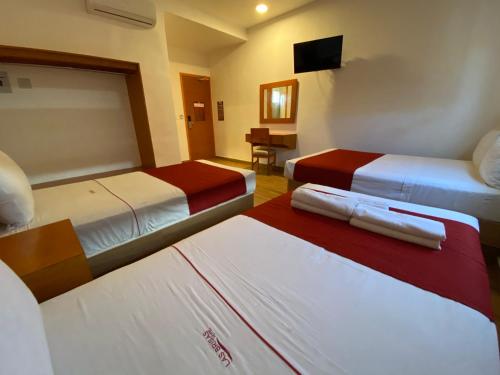 Postel nebo postele na pokoji v ubytování Hotel LB