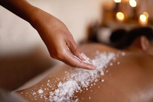a person washing their face in a sink with powdered sugar at Bay View Eco Resort & Spa in Port Antonio