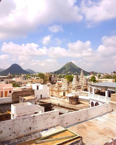 a view of the city from the roof of a building at Inn Seventh Heaven in Pushkar