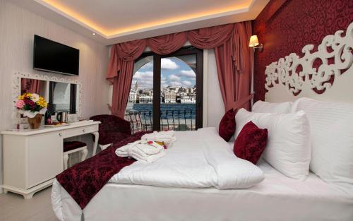 a hotel room with a white bed and a window at Dream Bosphorus Hotel in Istanbul