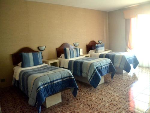 Postel nebo postele na pokoji v ubytování Hotel Costa Pacifico