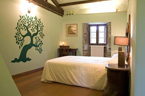 מיטה או מיטות בחדר ב-Casa Berdeal