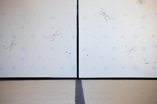 a glass door with a shadow on the floor at Higurashi-sou in Kyoto