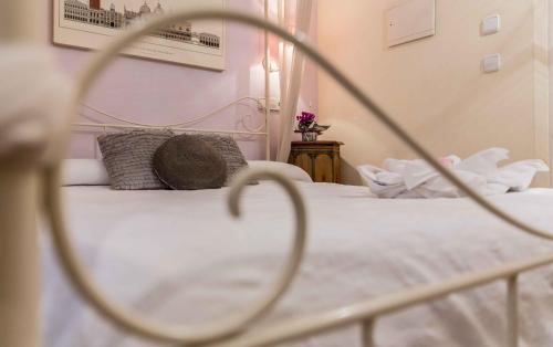 a close up of a bed with white sheets and pillows at Residencial Terra de Mar Calpe, Grupo Terra de Mar, alojamientos con encanto in Calpe
