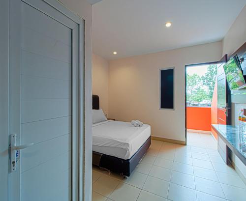 Tempat tidur dalam kamar di Dna Fun Zone Pekanbaru