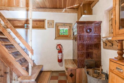 a room with a fire hydrant on the wall at Baita Pizabornè in Groppe de Fora