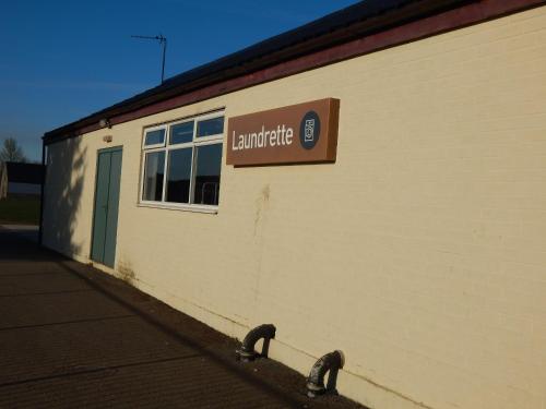 a sign on the side of a building at Flamingo Land - Cedar Wood CW49 in Kirby Misperton