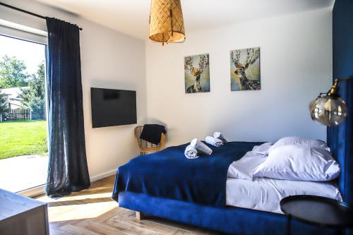 Ένα ή περισσότερα κρεβάτια σε δωμάτιο στο Apartamenty Skarpa