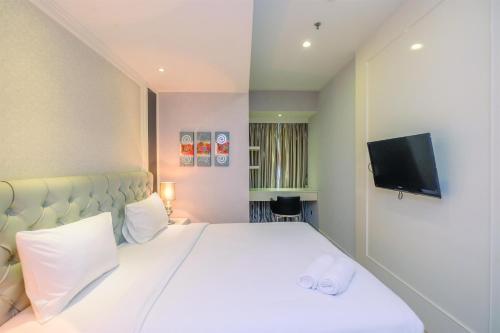 Spacious with City View 2BR Apartment at Casa Grande Residence By Travelio