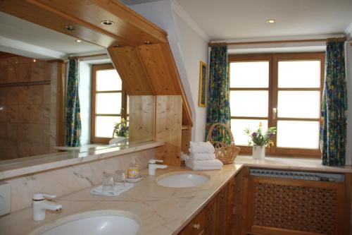 a bathroom with a sink and a mirror at Villa Salis in Altaussee