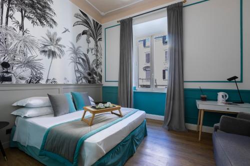 a bedroom with a bed with a table on it at Hotel Coppede' in Rome
