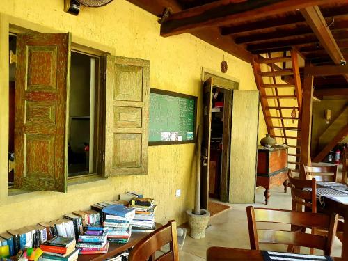 a room with a table with books on it at Dunes Unawatuna Hotel in Unawatuna