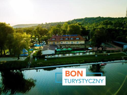 a sign that reads bon tivyatown next to a river at Hotel Vistula in Krakow