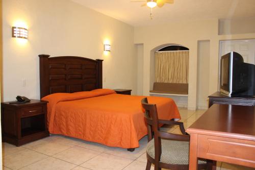 Un pat sau paturi într-o cameră la Hotel Real Posada