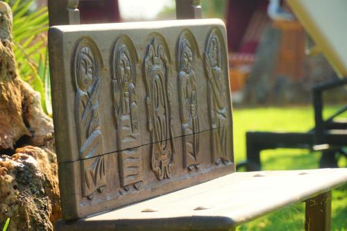 a wooden bench with a pattern on it at Agroturismo Finca Sa Tanca in Cala d´Or
