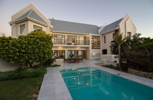 a house with a swimming pool in front of it at The View in Port Alfred