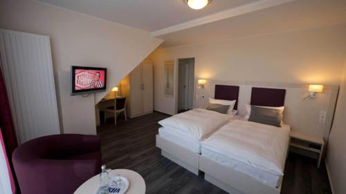 Katil atau katil-katil dalam bilik di Hotel Westfalia