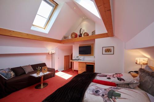 a living room with a couch and a table at Hotel Krone in Schruns-Tschagguns
