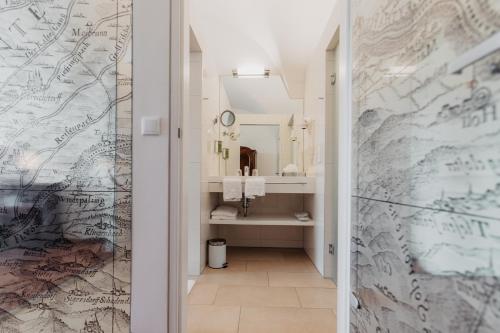 a bathroom with a sink and a mirror at Freigut Thallern in Gumpoldskirchen