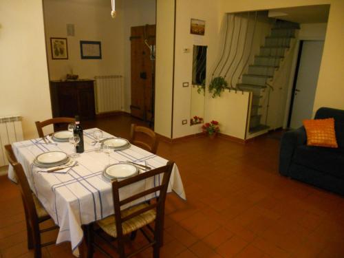 a dining room with a table with a white table cloth at Santacroce 52 in Florence