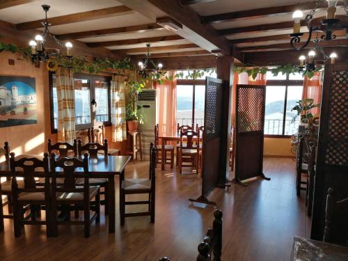 a dining room with a table and chairs at Balcón del Velillos-"Rincón de Marcelo" in Tózar