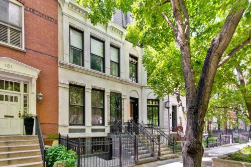 a brick building with a tree in front of it at Historic luxury Townhouse in Downtown Chicago in Chicago