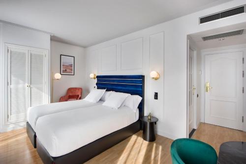 מיטה או מיטות בחדר ב-Hotel Inca