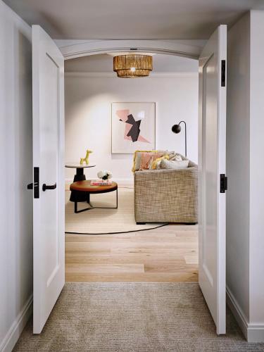 a living room with a couch and a table at White Elephant Palm Beach in Palm Beach