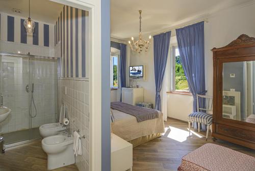 a bathroom with a sink and a toilet and a shower at Villa Agnolaccio Residenza d'Epoca in Pistoia