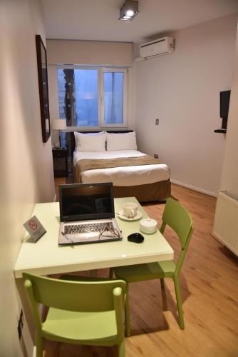Ένα ή περισσότερα κρεβάτια σε δωμάτιο στο Lastarria Aparts
