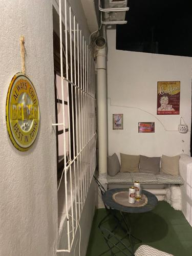 a room with a table and a sign on a wall at Apartamento Completo en el centro de Durazno in Durazno