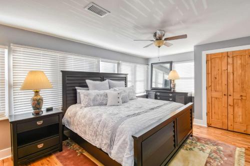 a bedroom with a bed and a ceiling fan at 1 Fletcher Ln in St. Augustine