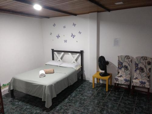 Posteľ alebo postele v izbe v ubytovaní Kitnet Rio Vermelho