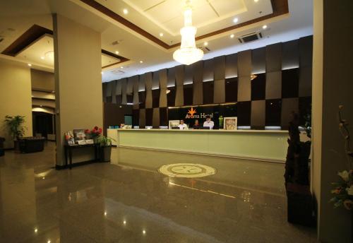 a lobby with a restaurant with a bar in it at Aroma Hotel in Butterworth