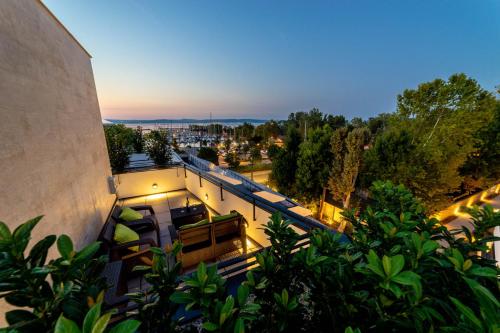 an overhead view of a building with a balcony at LAKE MOMENTS - Emerald Penthouse in Balatonszemes