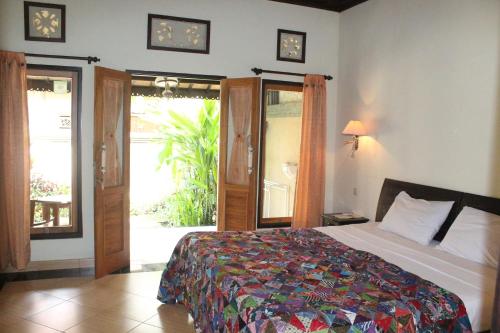 Cama o camas de una habitación en Trijaya Guest House Pemuteran