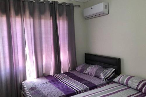 A bed or beds in a room at Amazing Chalet at Bluebay Asian Resort Pool View - Families Only