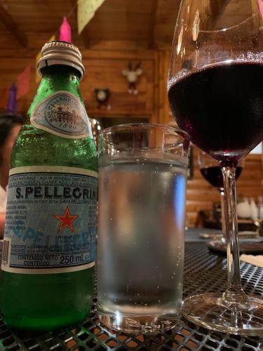 a bottle of beer and a glass of water on a table at Villarreal Lodge Hotel Ecológico in Totolapan
