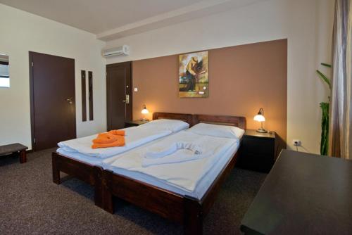 Hotel U Zlatého býkaにあるベッド