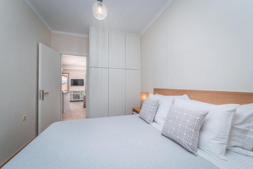 Ένα ή περισσότερα κρεβάτια σε δωμάτιο στο Asteria Apartments